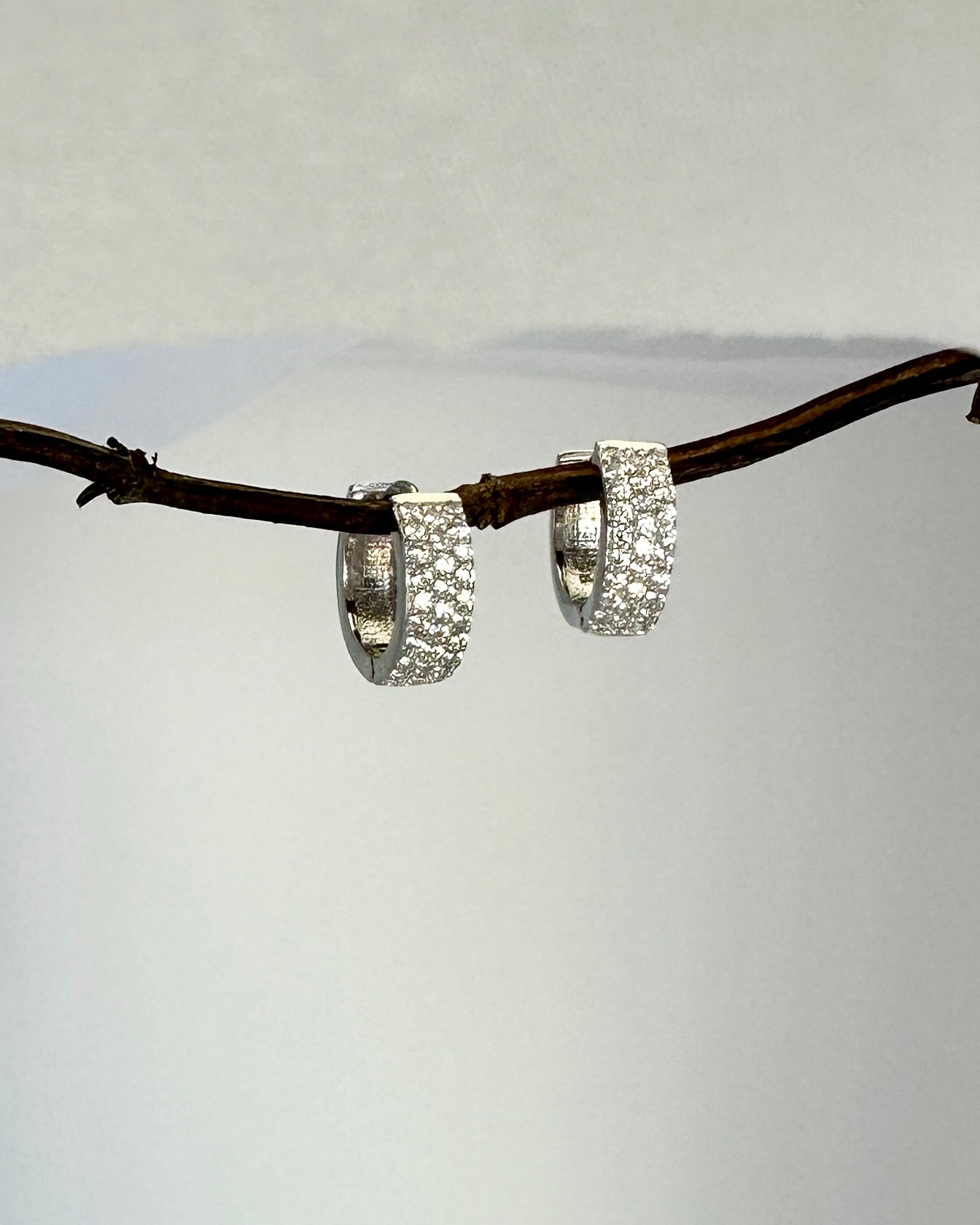 Candella Pavé Triple Row Mini Huggie Earrings Silver